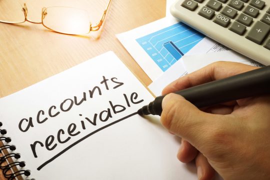 Accounts receivable written by hand in a note. Accounts receivable written by hand in a note.